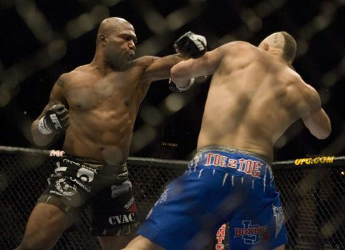 Quinton Jackson, left, takes a swing at Chuck Liddell during UFC 71.