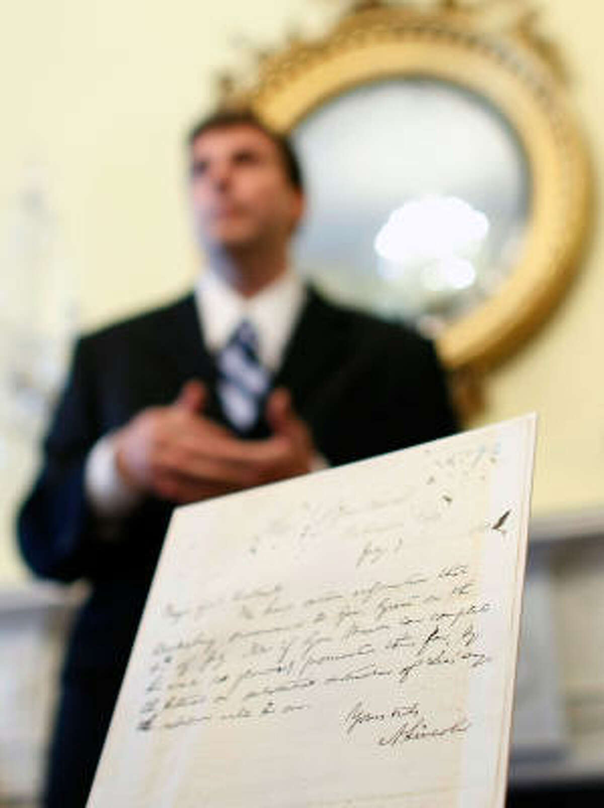 Trevor Plante, a specialist in Civil War records, displays the letter written by Abraham Lincoln at the National Archives in Washington on Thursday.