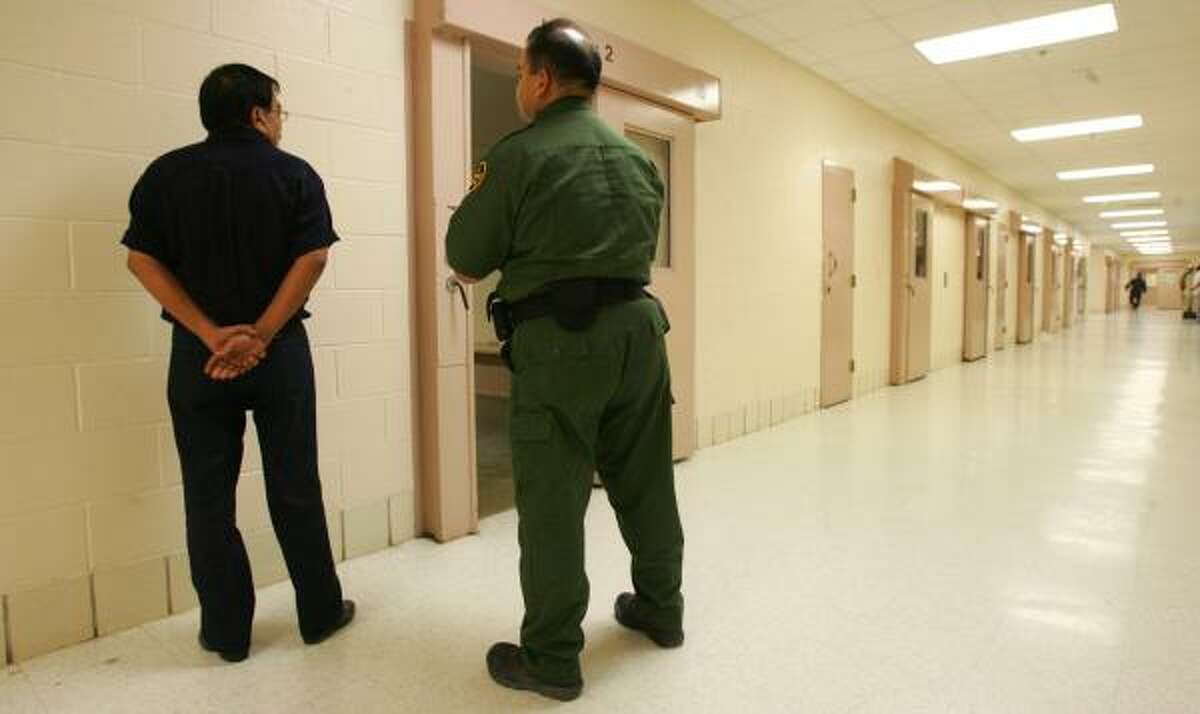 A U.S. Border Patrol agent interviews a new inmate at the Hidalgo County Adult Detention Center. The man, who said he was from Monterrey, Nuevo Leon, was among a dozen assigned to the agent on Friday.