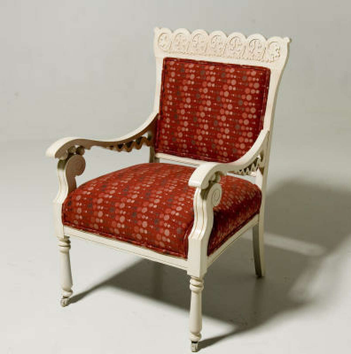 It cost $53 for fabric from High Fashion Home and $410 to have I & J Custom paint and reupholster the chair.