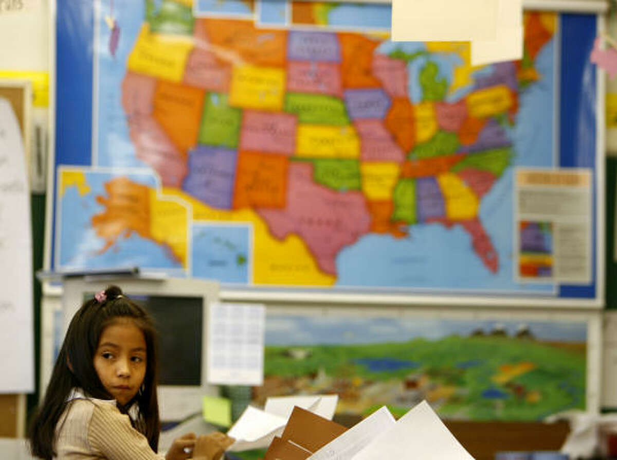 Rachel Ortiz, 6, works in her first-grade classroom at Vilas Elementary School in El Paso. She and her father are both U.S. citizens and often cross from Juarez, Mexico, to El Paso for Rachel to go to school.