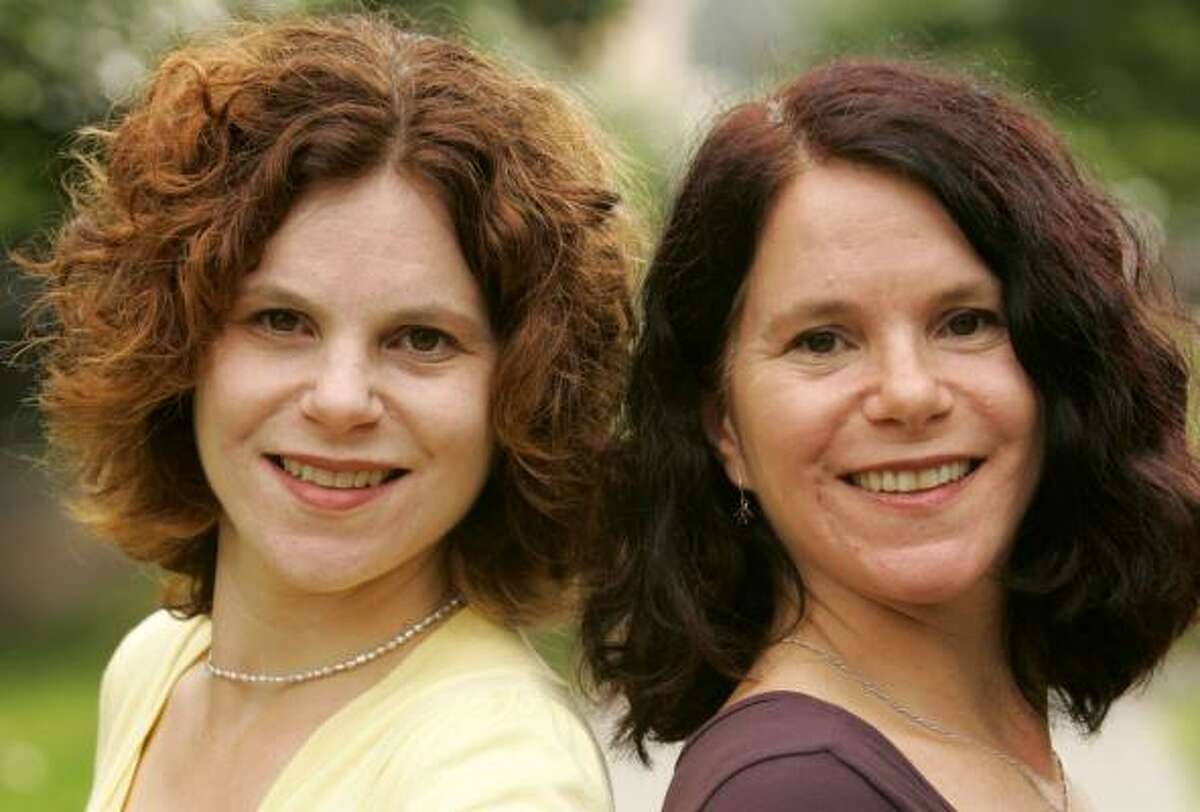 Paula Bernstein, left, and Elyse Schein are identical twins who were separated at birth and reunited 35 years later. They have written a book about their lives, Identical Strangers.