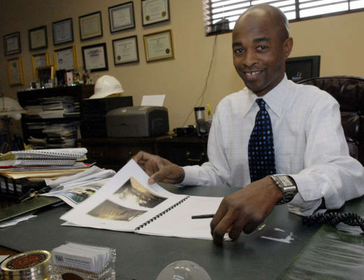 Gerald Womack owner of Womack Development & Investments Realtors Inc poses in his office.