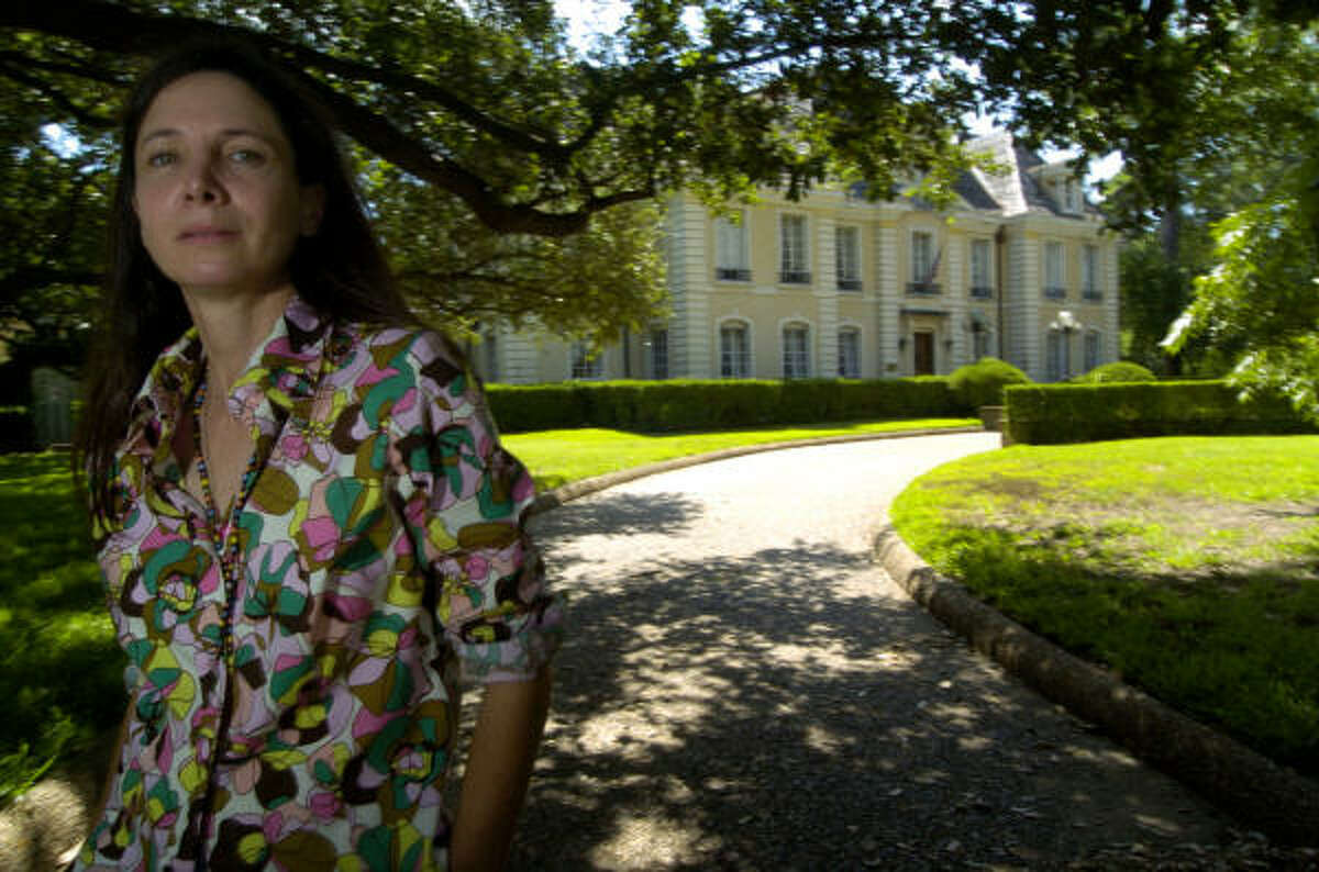Susan Conte stands in front of her family's River Oaks mansion. The Conte family is fighting the probate court for what they consider to be a waste of more than $1 million of their money.