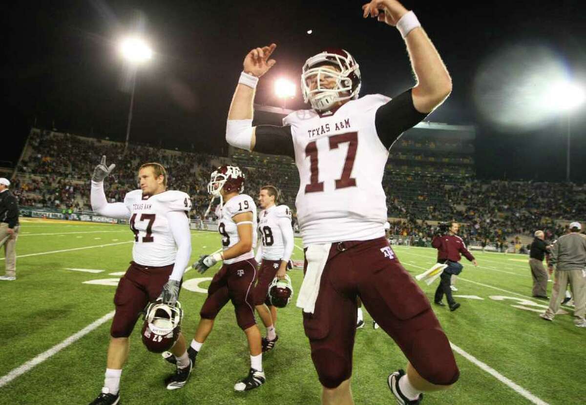 A&M quarterback Ryan Tannehill, celebrating the Baylor win last year, is one of 10 returning offensive starters — one reason the Aggies are ninth in the preseason coaches’ poll.
