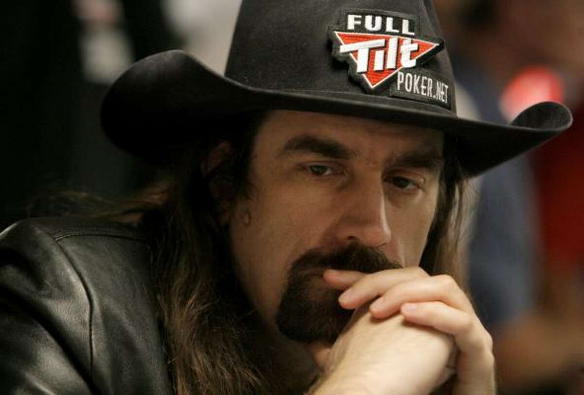 Professional Chris Ferguson contemplates a hand in the early going of the main event of the World Series of Poker.