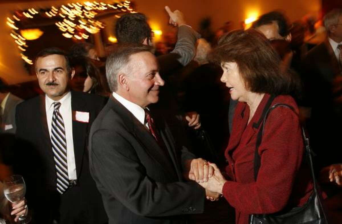 Republican presidential candidate Tom Tancredo thanks supporter Joyce Ellington at a fundraiser Tuesday night at Maggiano's Little Italy restaurant.
