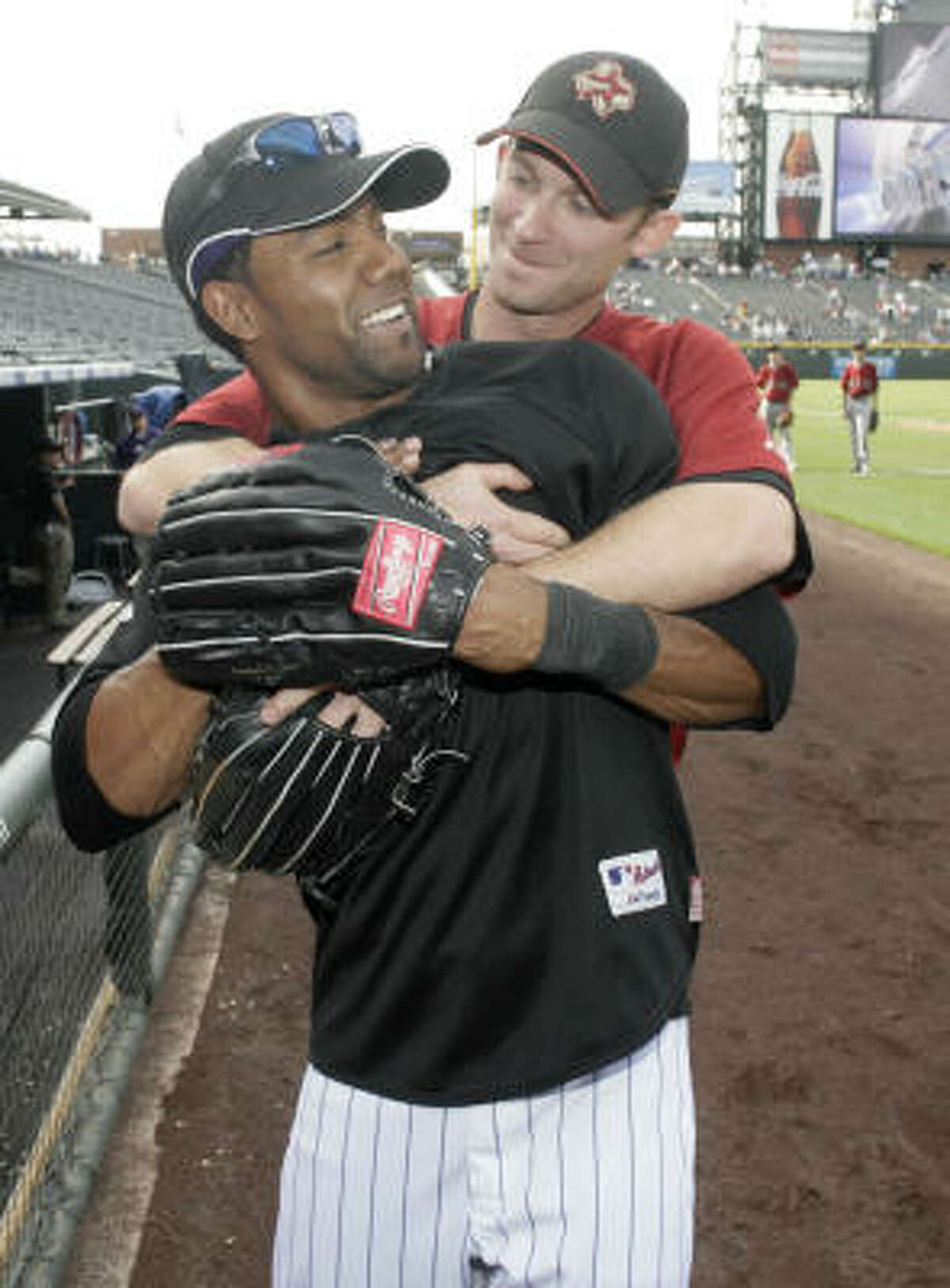 Willy Taveras may miss friends like former Astros teammate Adam Everett, but he's happy to be playing with the Colorado Rockies.