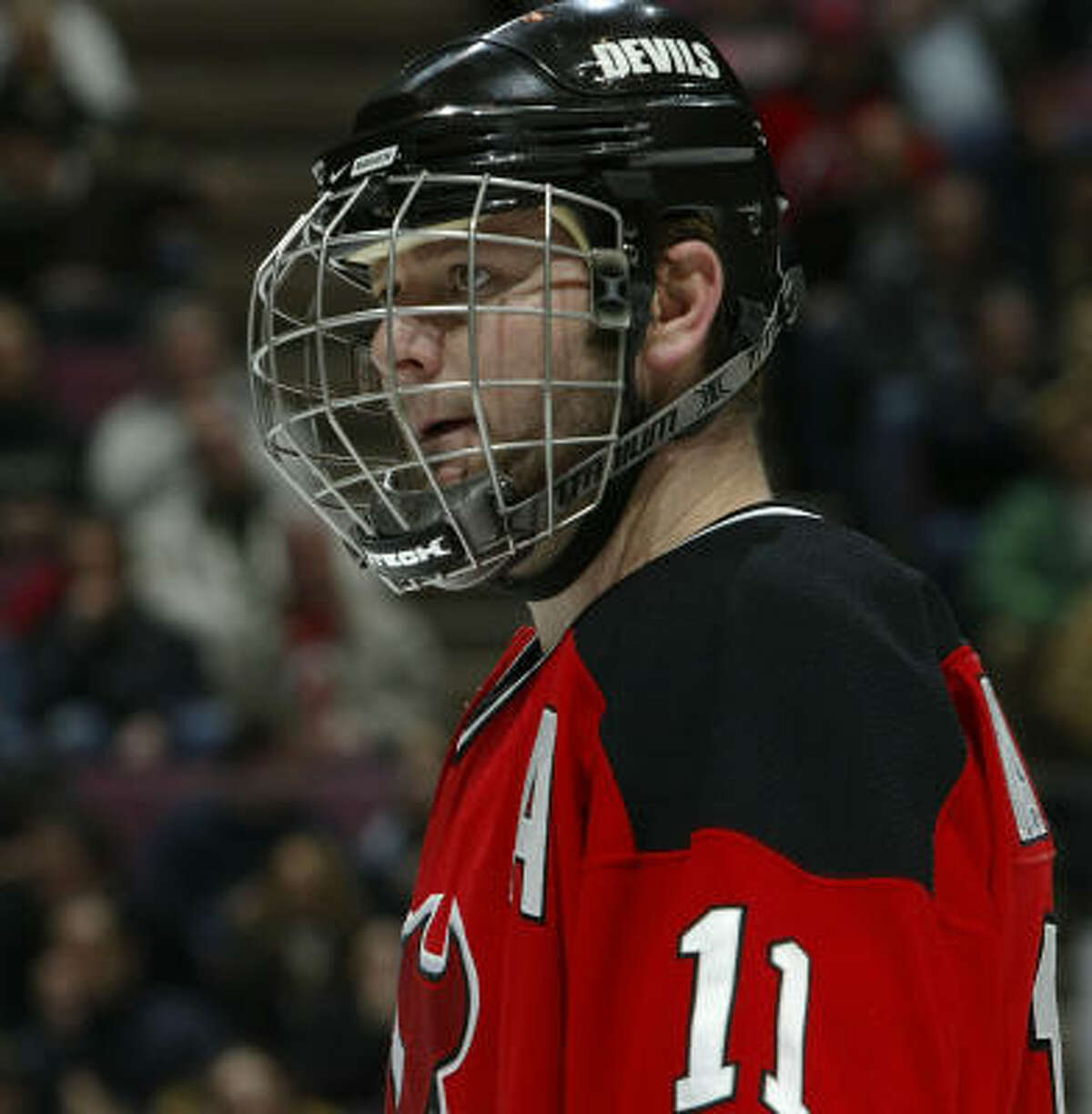 Devils center John Madden returned Friday after missing one game with a facial laceration; he had a protective cage mask attached to his helmet.