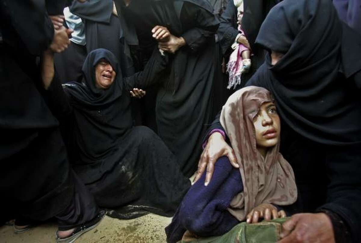 Jan. 3 | The Fayyad family mourns five relatives killed by an Israeli tank shell. | Khan Younis, Gaza Strip