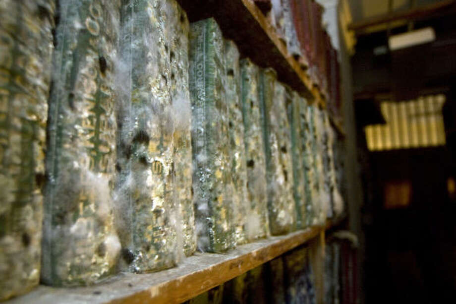 Historic losses | Mold damaged books on the lower floors of the Rosenberg Library, home of the Galveston and Texas History Center. | Sept. 20 | Galveston Photo: Johnny Hanson, Houston Chronicle
