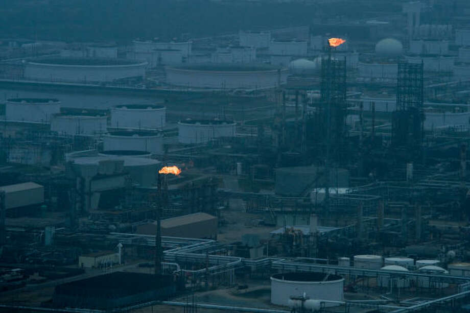 Back to work | Flares light up a refinery as the facility starts up again after the hurricane. | Sept. 13 | Texas City Photo: Smiley N. Pool, Houston Chronicle