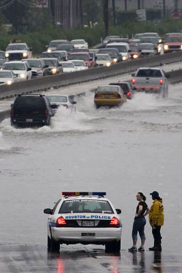 Soggy commute | Traffic gingerly passes through high water on Interstate 45 at Tidwell as the city encounters more rain and flooding. | Sept. 14 | Houston Photo: Smiley N. Pool, Houston Chronicle