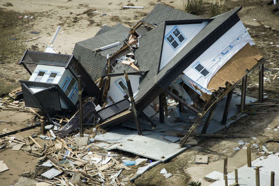 Decimated | A crumpled house lies amid the rubble. | Sept. 15 | Crystal Beach Photo: Smiley N. Pool, Houston Chronicle