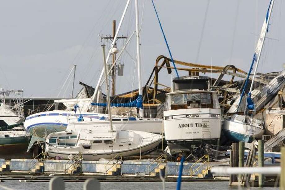 Jumbled| Boats are stacked on top of each other at a marina. | Sept. 15 | Galveston Photo: Brett Coomer, Houston Chronicle