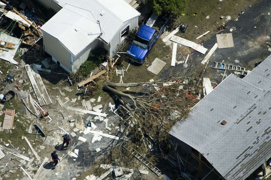 Into the debris | Search teams comb damaged neighborhoods. | Sept. 15 | Port Bolivar Photo: Smiley N. Pool, Houston Chronicle