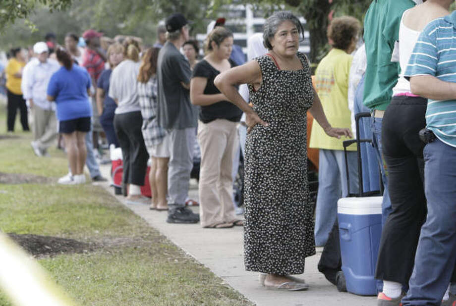 Essentials | Amelia Aguilar, 65, waits in line at a FEMA distribution site. She arrived at 5:30 a.m. to be one of the first people to get supplies when the site opened at 9 a.m. | Sept. 18 | Houston Photo: Julio Cortez, Houston Chronicle