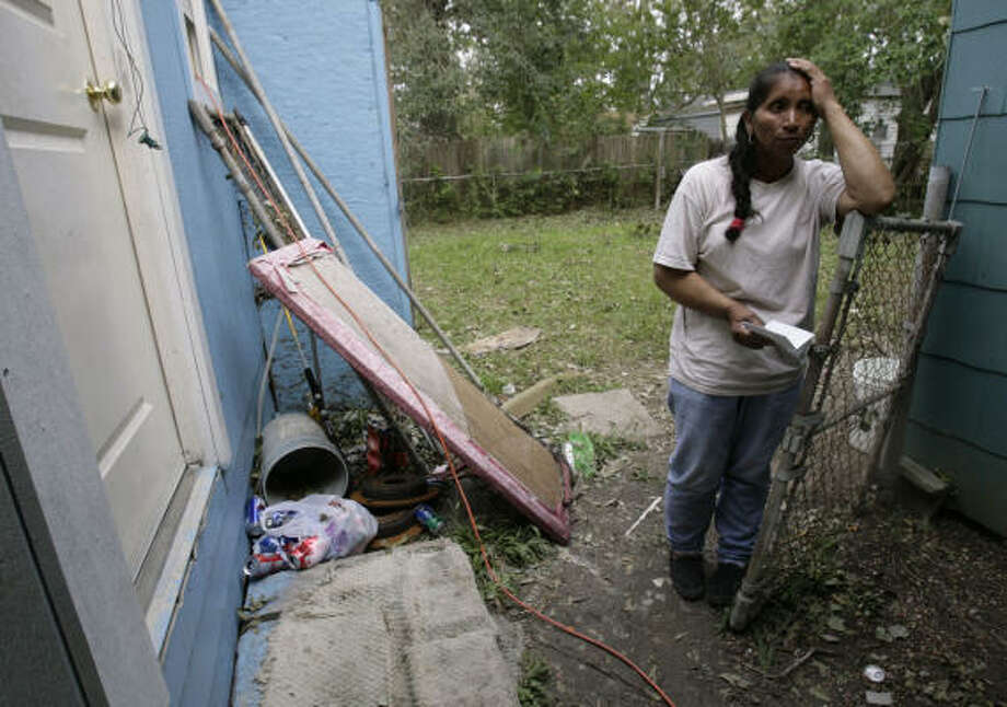 Victimized | Maria Morales, 60, said bad luck continued to pile up after the hurricane. Not only was her home on Whitaker damaged, she said, but the generator she was using to light her home was stolen from her back yard. | Sept. 18 | Pasadena Photo: Julio Cortez, Chronicle