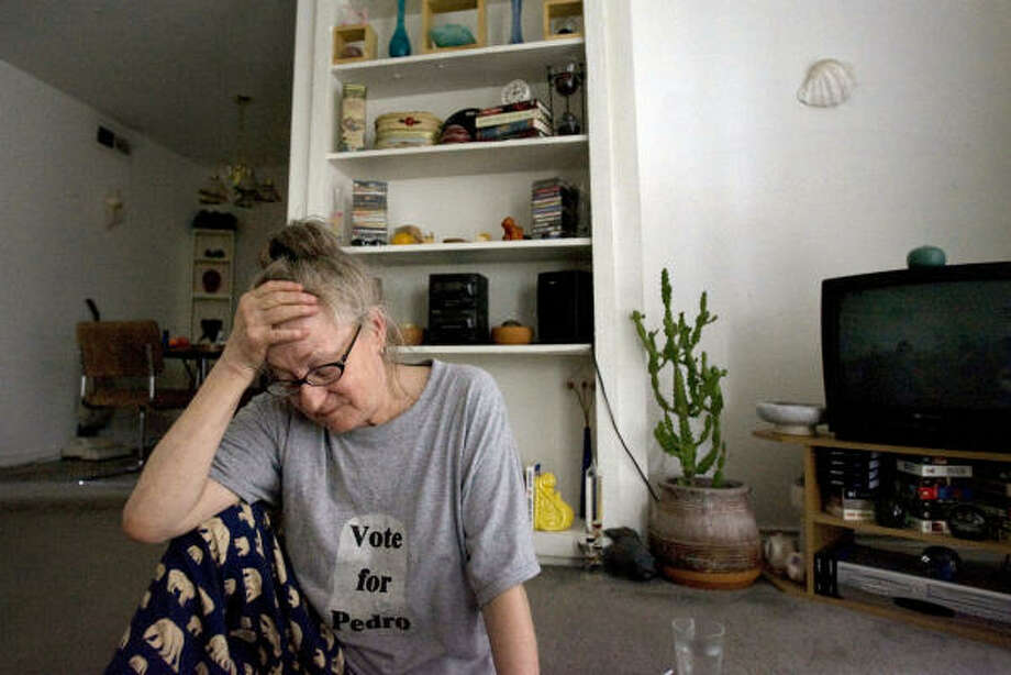 Left out | Madelaine Carter had gone a week and a half without lights or air conditioning in her apartment on the northwest side of the city. A few doors away, though, neighbors had electricity. "Sometimes I feel like I'm going crazy," she said. | Sept. 23 | Houston Photo: Johnny Hanson, Houston Chronicle