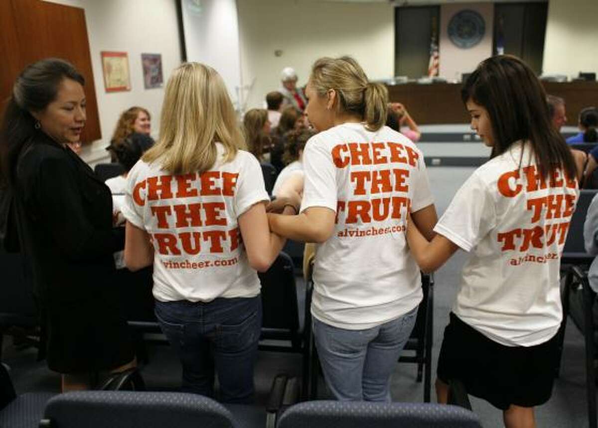 Leticia Bailey, left, attends the Alvin school board meeting Tuesday night with the three students suspended for taking and sharing a cell phone photo of a cheerleader getting out of a shower. Her daughters, Crystal Bailey, 13, and Ashley Bailey, 17, are shown with Ruby Ruiz, 13, whose phone was used to take the photo.