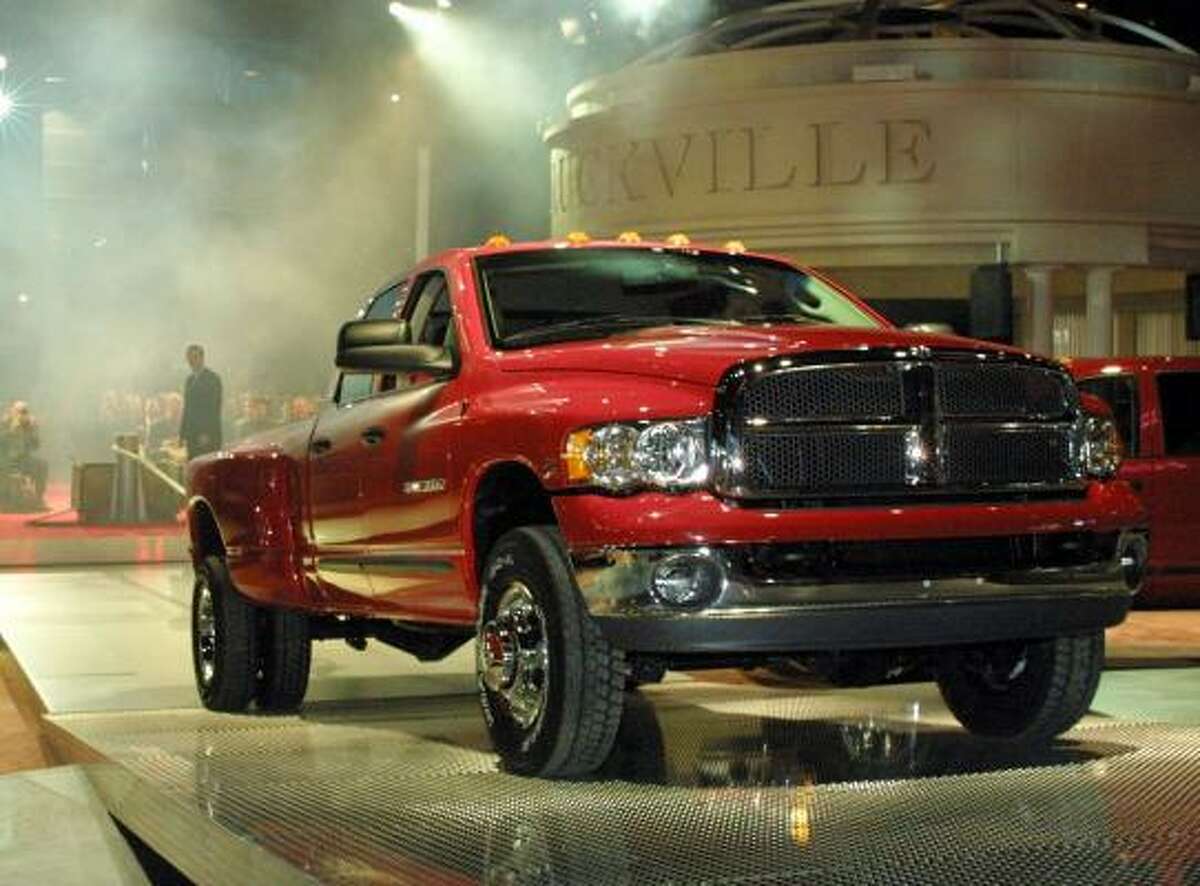 The towing capacity of a Dodge Ram Heavy Duty pickup is showcased.