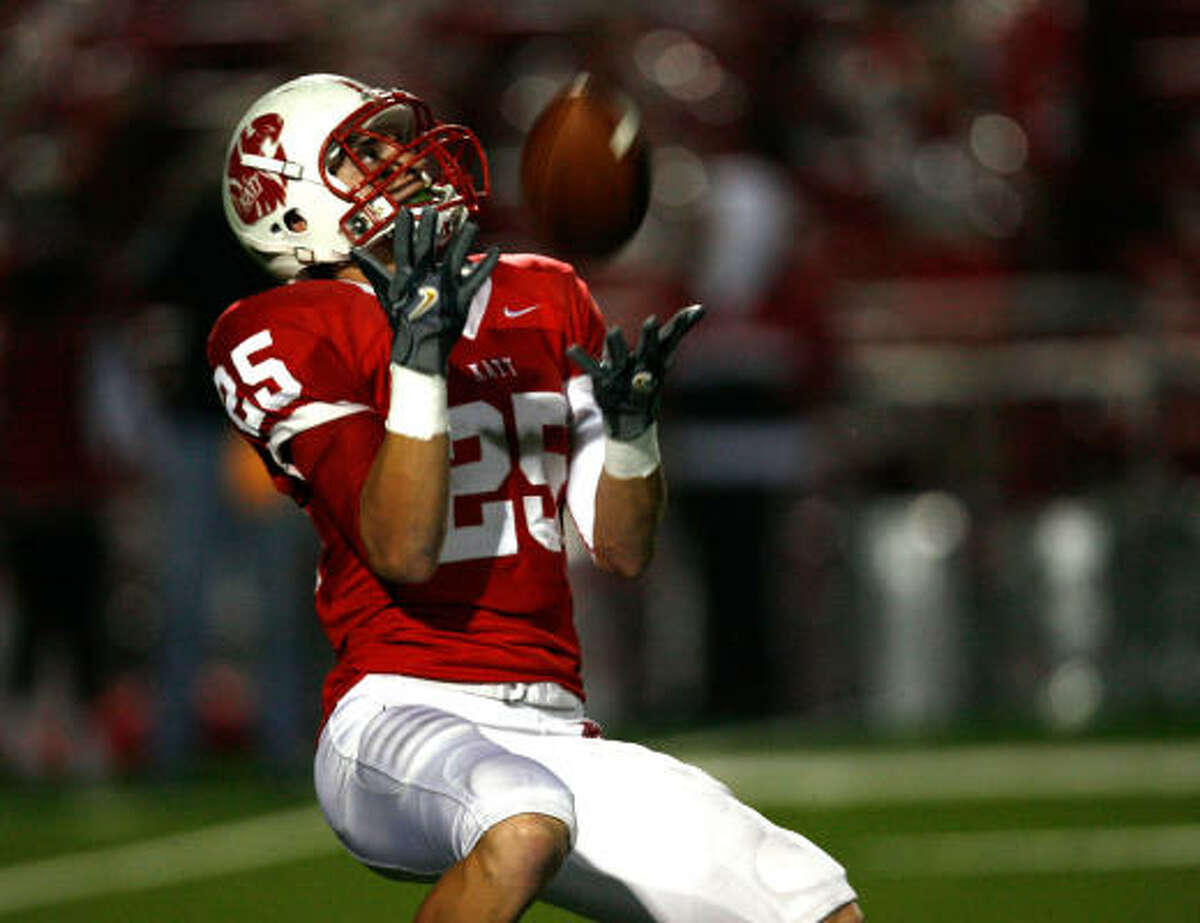 Katy 38, Dickinson 7 Katy's Sam Holl watches the ball fall into his arms in the first half against Dickinson.