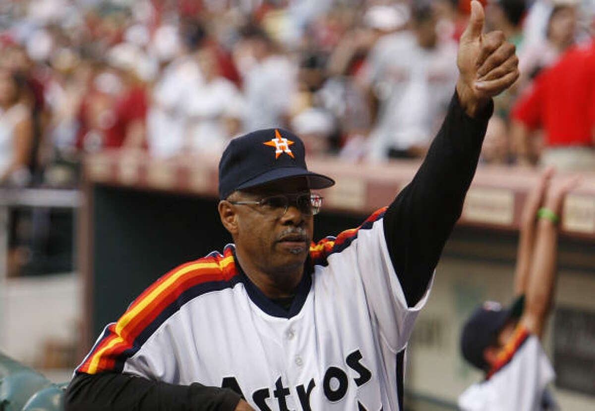 Cecil Cooper signals his family at the game against the Braves at Minute Maid Park on Friday.