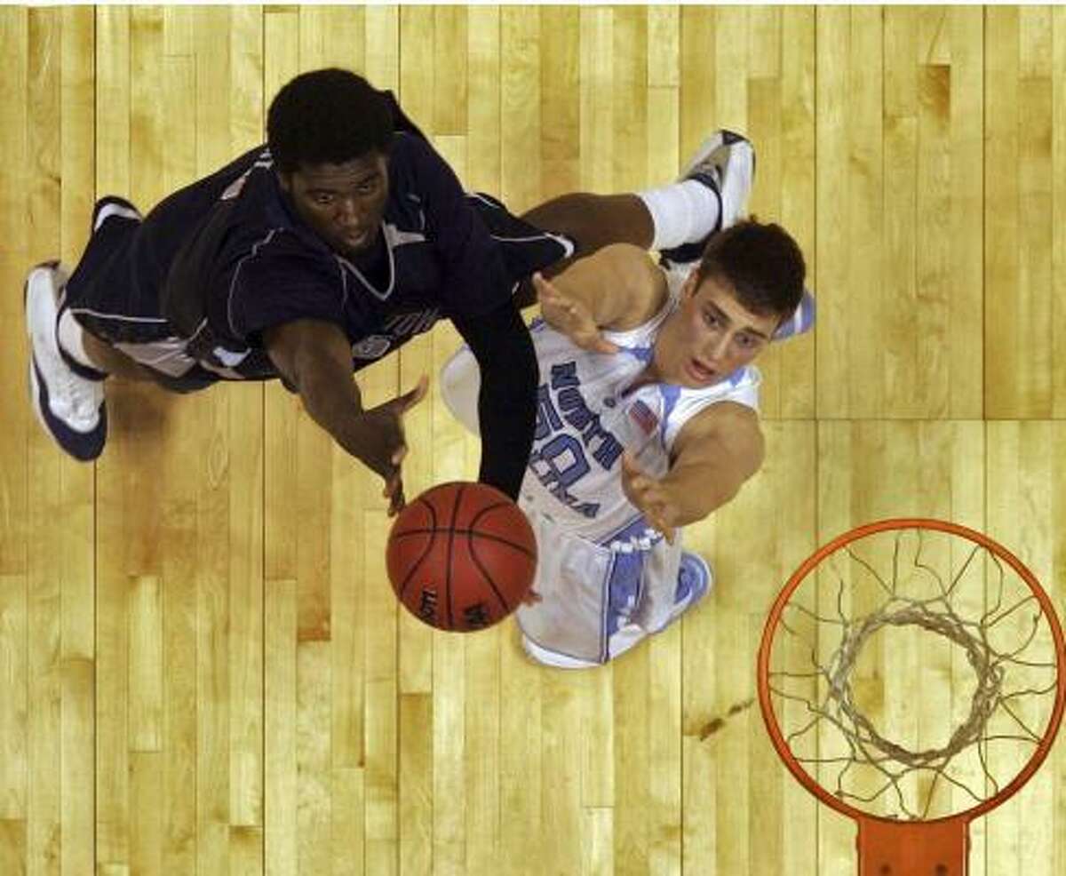 Roy Hibbert and Tyler Hansbrough go after a rebound in the East Regional final in East Rutherford, N.J.