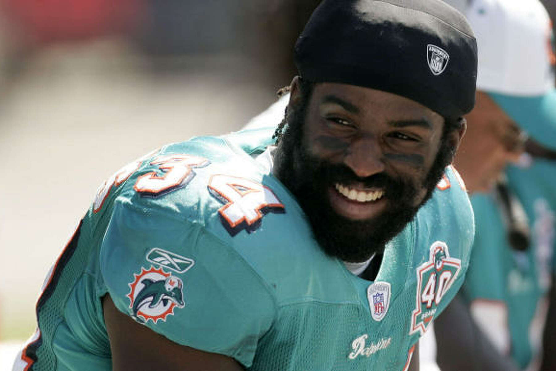 Miami Dolphins running back Ricky Williams checks play September 7