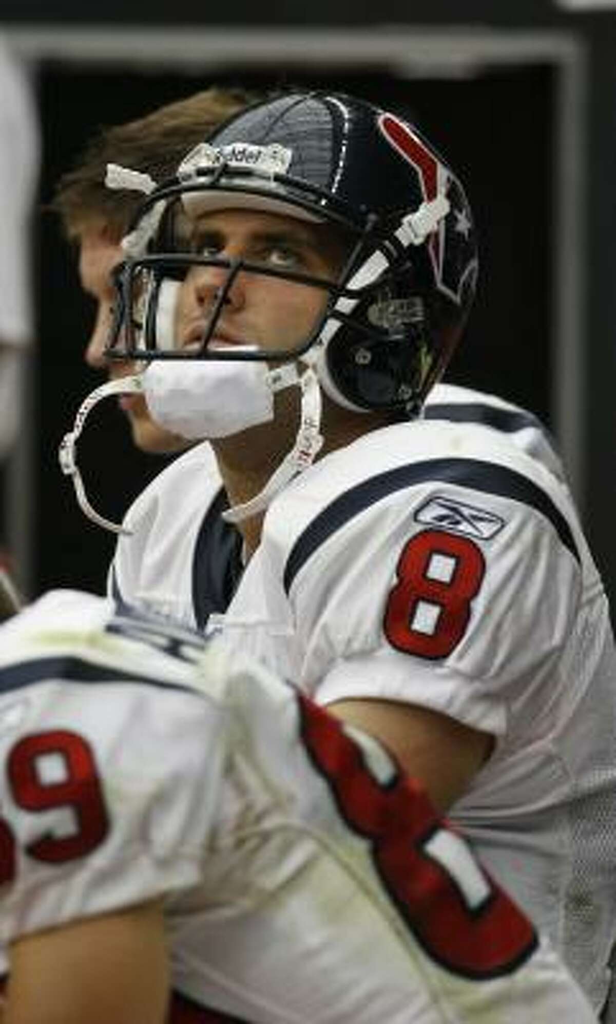 Matt Schaub is relegated to spectator in the fourth quarter after being knocked out of the game by a hard hit from Tennessee's Albert Haynesworth.