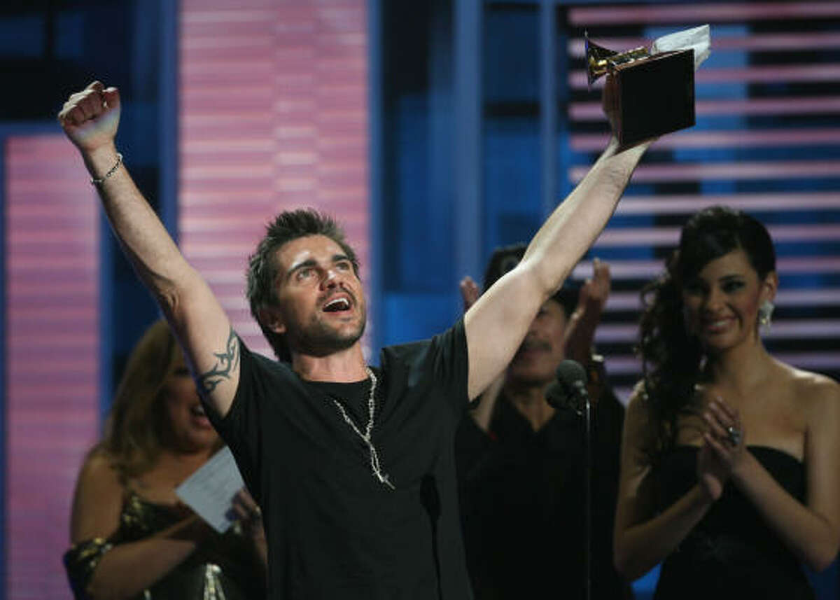 Juanes celebrates his fifth Grammy award.