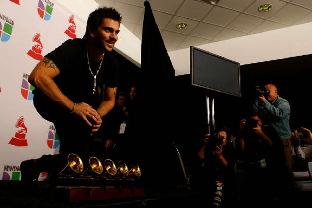 Juanas poses with his five Grammy awards.