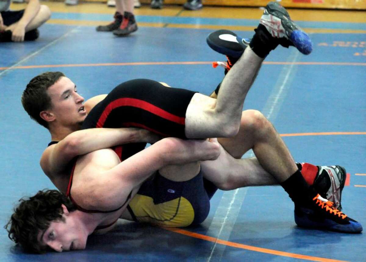 Tucker Schaer, top, of Danbury, representing the West, wrestles and wins the 160 lb. match against Ryan Kuska, of the South, during the Nutmeg Games at Danbury High on sunday.