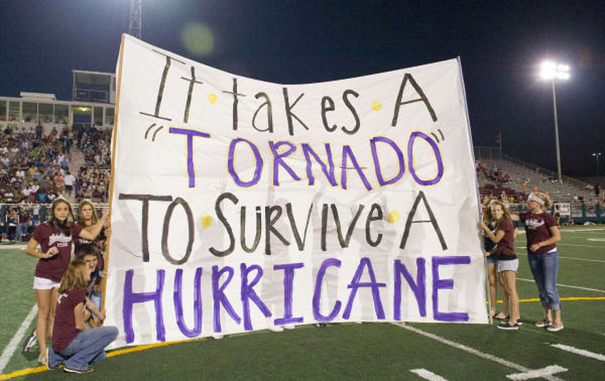 Members of the Clear Creek student body display a message to the Galveston Ball Tornado fans during halftime.