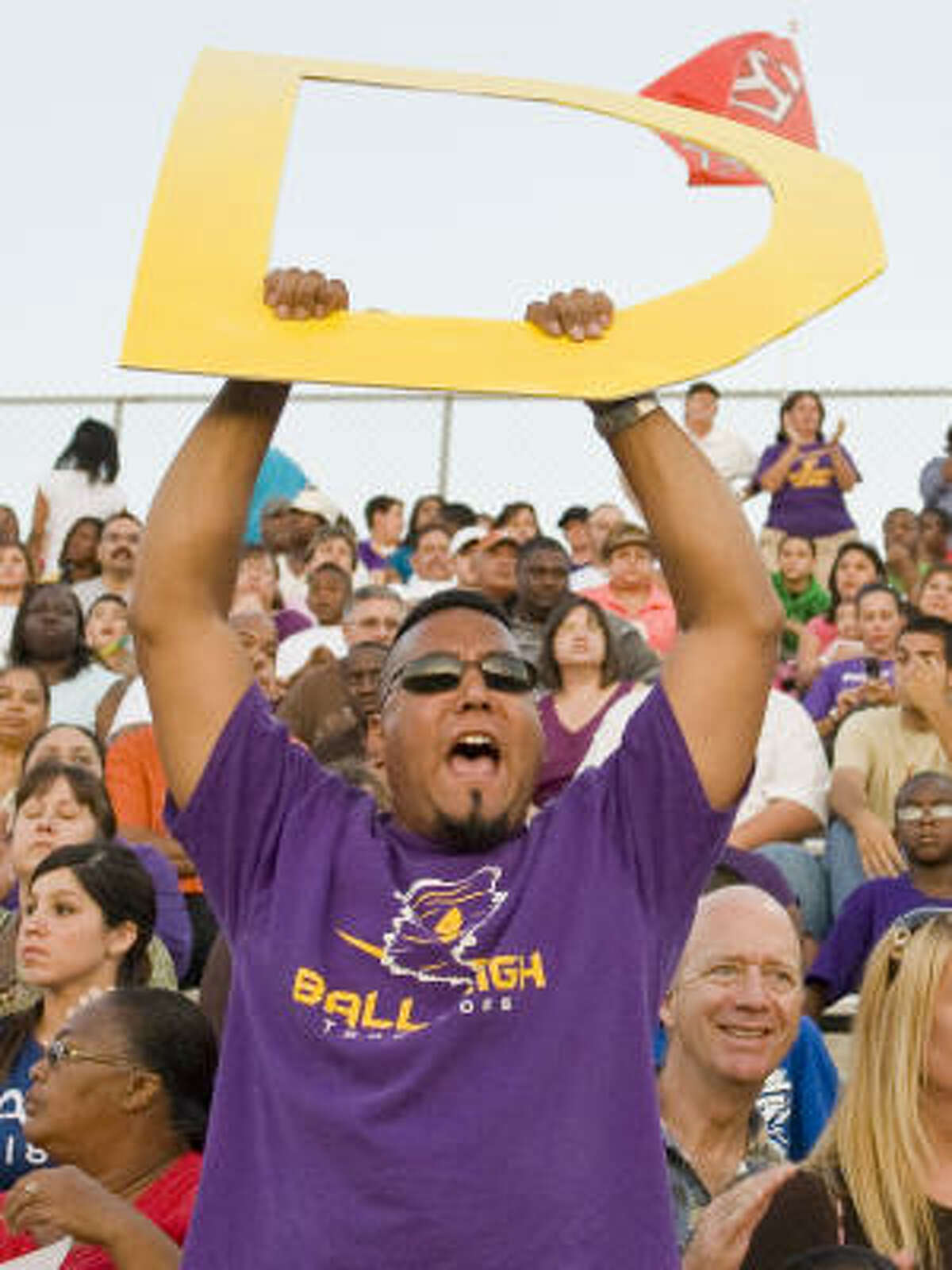Galveston Ball fan Jason Cardenas yells for defense during their game against Clear Creek Oct. 4, 2008. The game was Ball's first since Hurricane Ike, a month-long wait.
