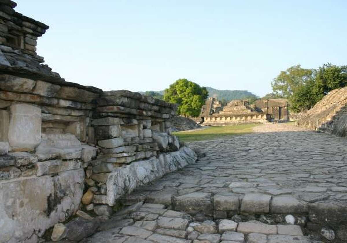 El Tajín contains more than four acres of pyramids, residential structures and ceremonial ball fields, including the famous Pyramid of the Niches, background.