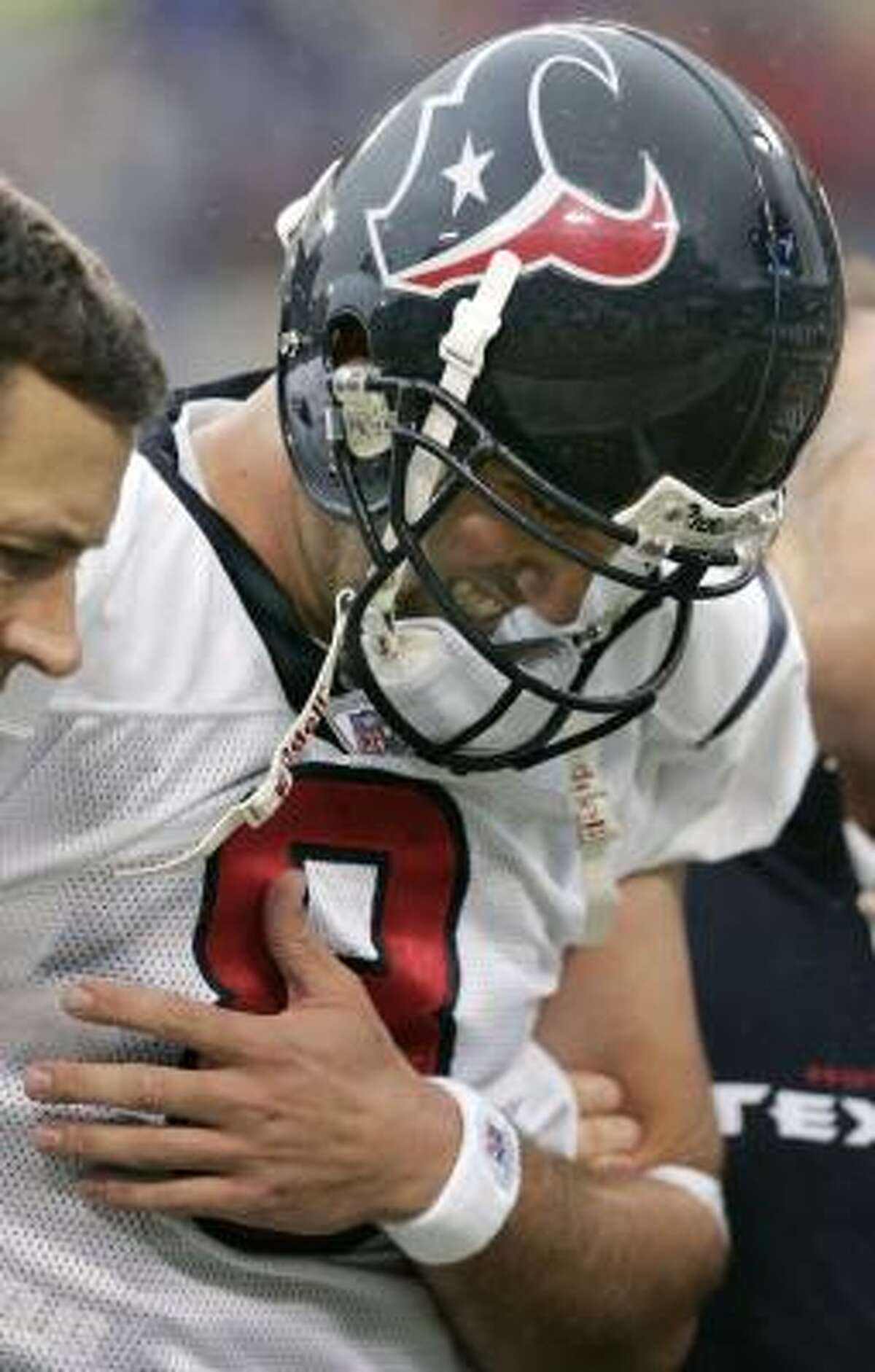 Texans quarterback Matt Schaub is helped off the field after suffering an injury against the Titans on Dec. 2. Head coach Gary Kubiak is hopeful he will play again this season.