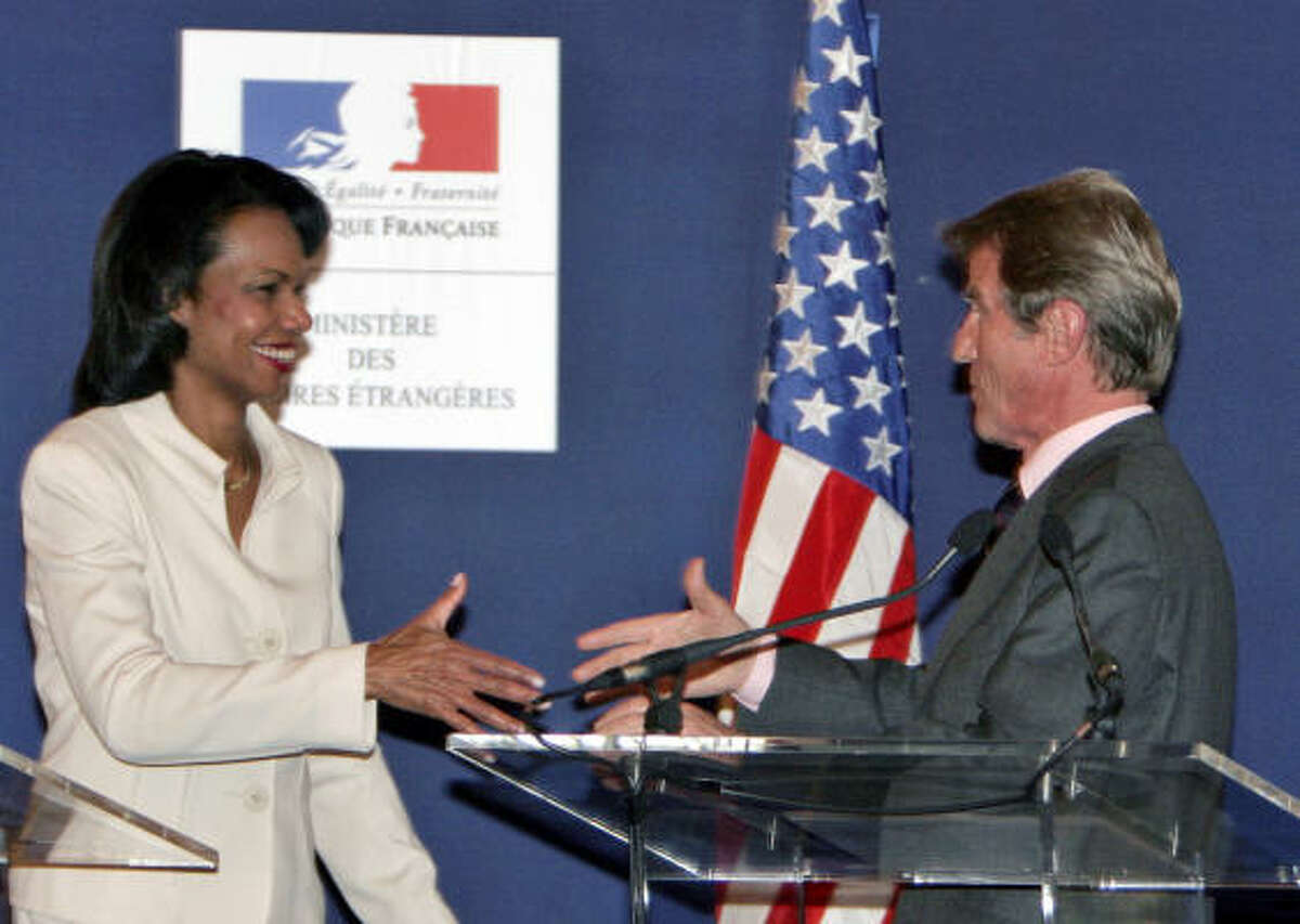 U.S. Secretary of State Condoleezza Rice, left, shakes hands with French Foreign Minister Bernard Kouchner at the end of their joint news conference in Paris, Sunday. Rice is in Paris for two days of get-to-know-you meetings with the new conservative-led French government and a strategy session on Darfur.