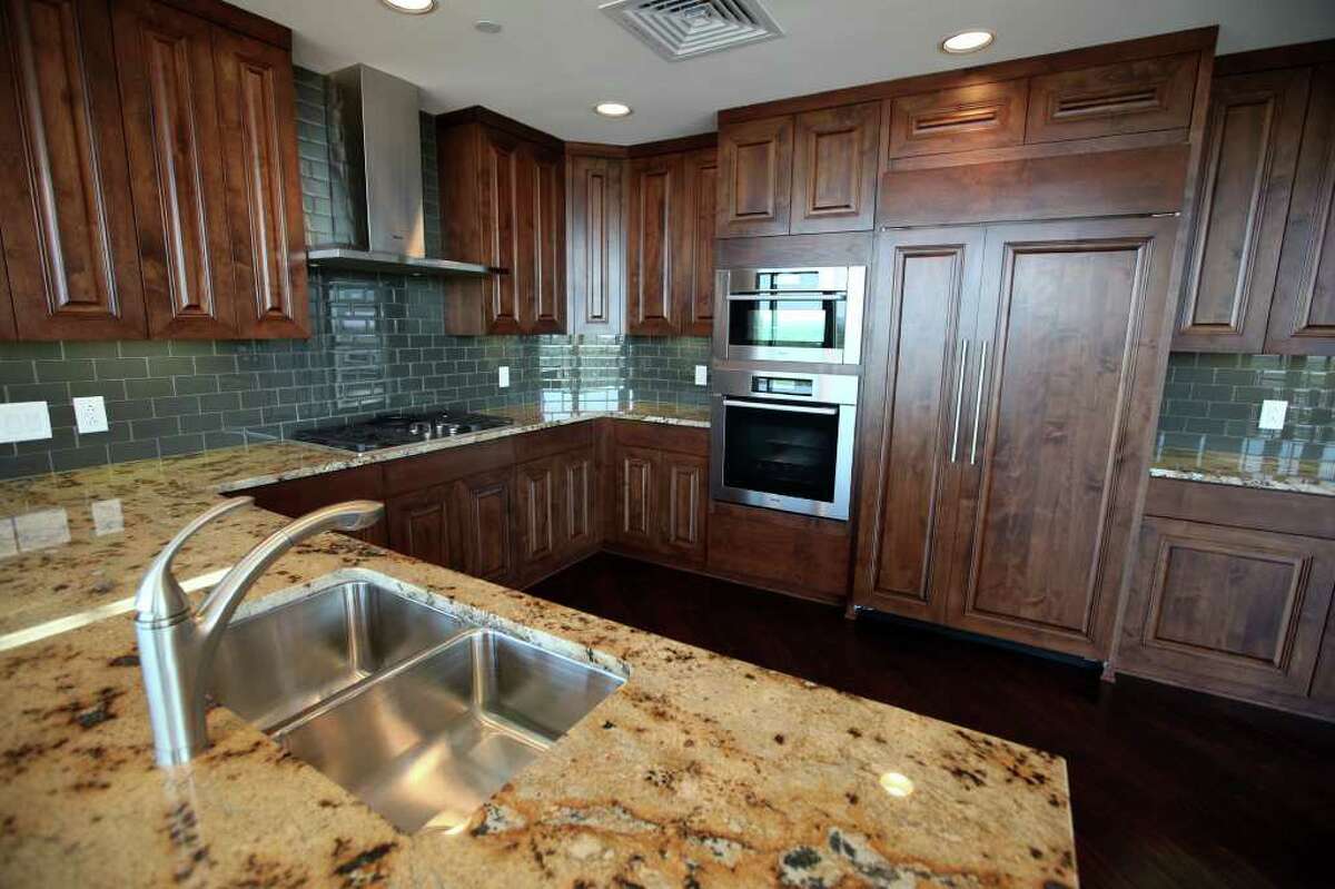 The kitchen of a condo at The Broadway luxury high-rise at 4242 Broadway Street.