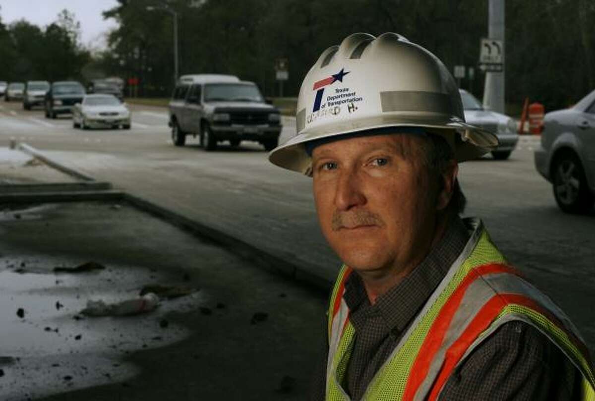 Texas Department of Transportation engineer Clifford Halvorsen is working on traffic lane designations on Woodway Drive.