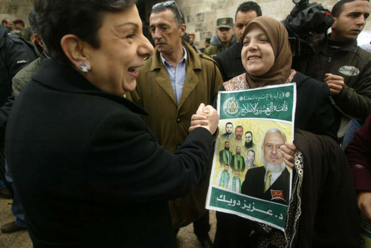 Palestinian legislator Hanan Ashrawi, left, meets with the wife of the Palestinian Parliament speaker last month. Ashrawi recently stopped in Houston for a fundraiser.
