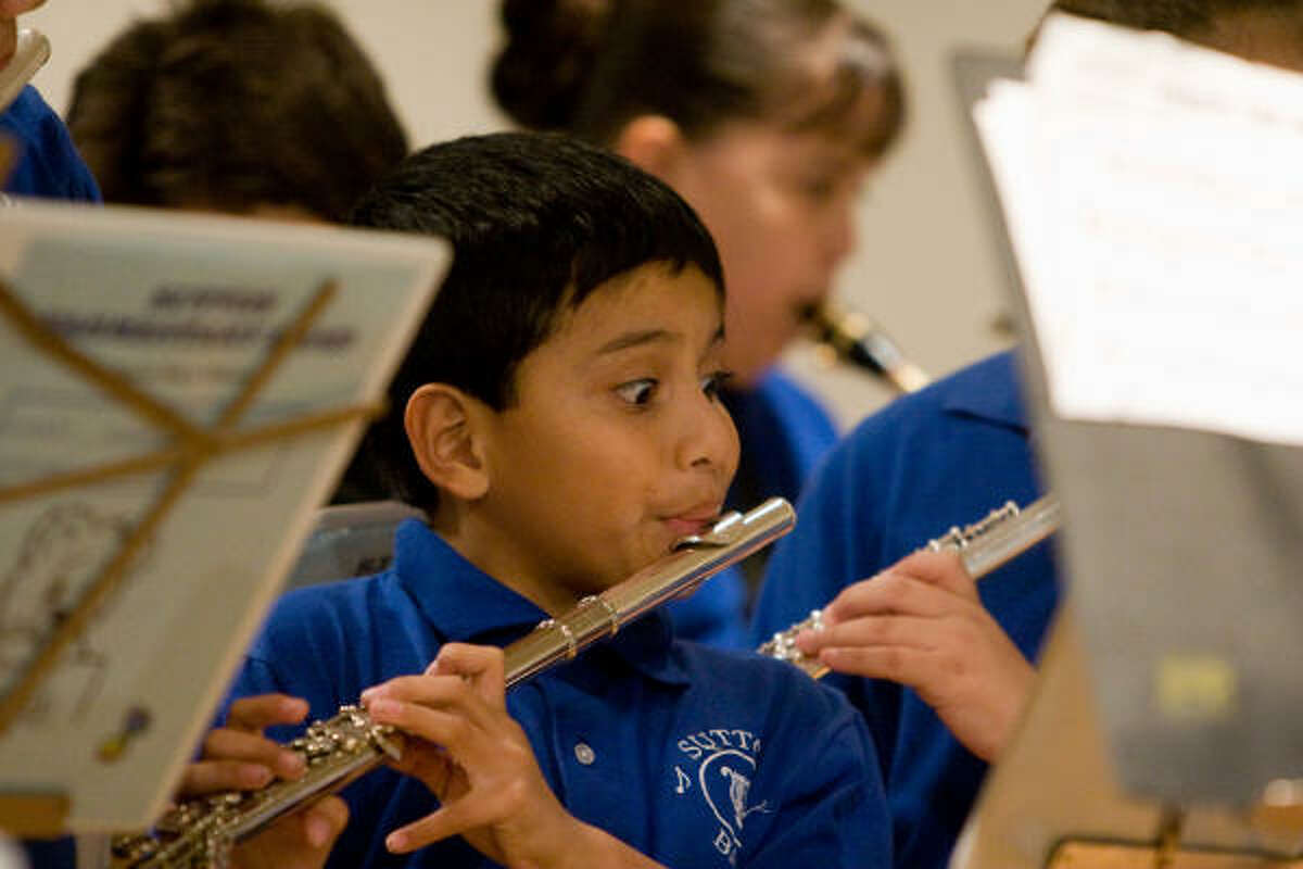 Kevin Melendez, a 9-year-old fourth-grade pupil and member of the Sutton Elementary School band, entertains duriing the Sharpstown Civic Association's annual meeting and Thanksgiving dinner on Nov. 15.