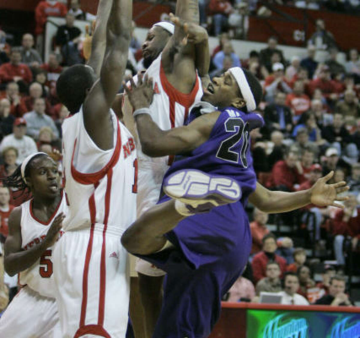 Kansas State's Cartier Martin (right) fouled out against Nebraska on Tuesday night.