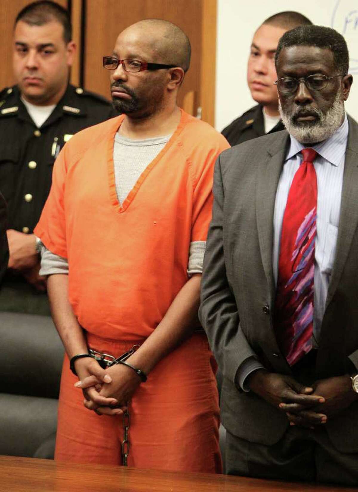 Anthony Sowell, left, stands with his attorney Rufus Sims as they listen as the jury recommends the death penalty Wednesday, August 10, 2011 in Cleveland. Sowell, who was convicted July 22 of aggravated murder in eleven women's deaths. (AP Photo/The Plain Dealer, Marvin Fong, Pool)