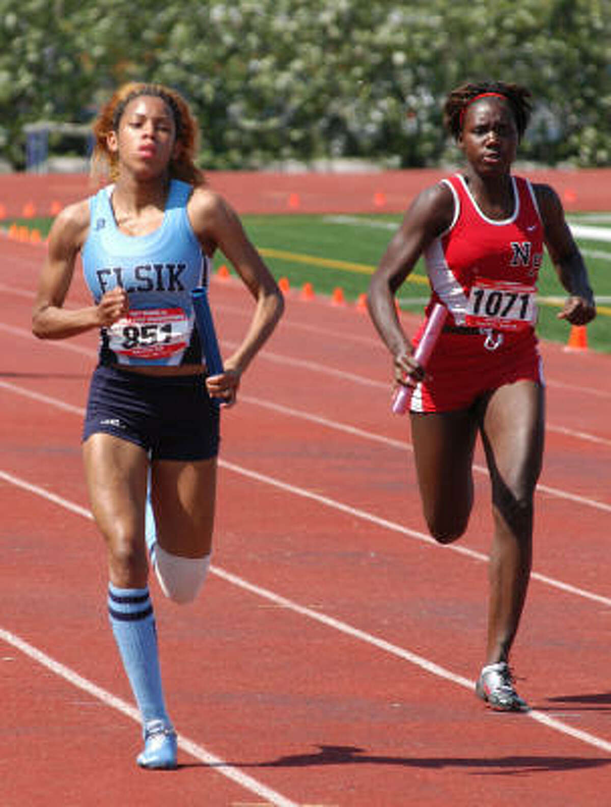 Elsik's Amber Evans beat North Shore's April Washington for second place in the 800-meter relay at the Class 5A Region III meet in Humble. Evans and her teammates earned a UIL State Meet berth in the event.