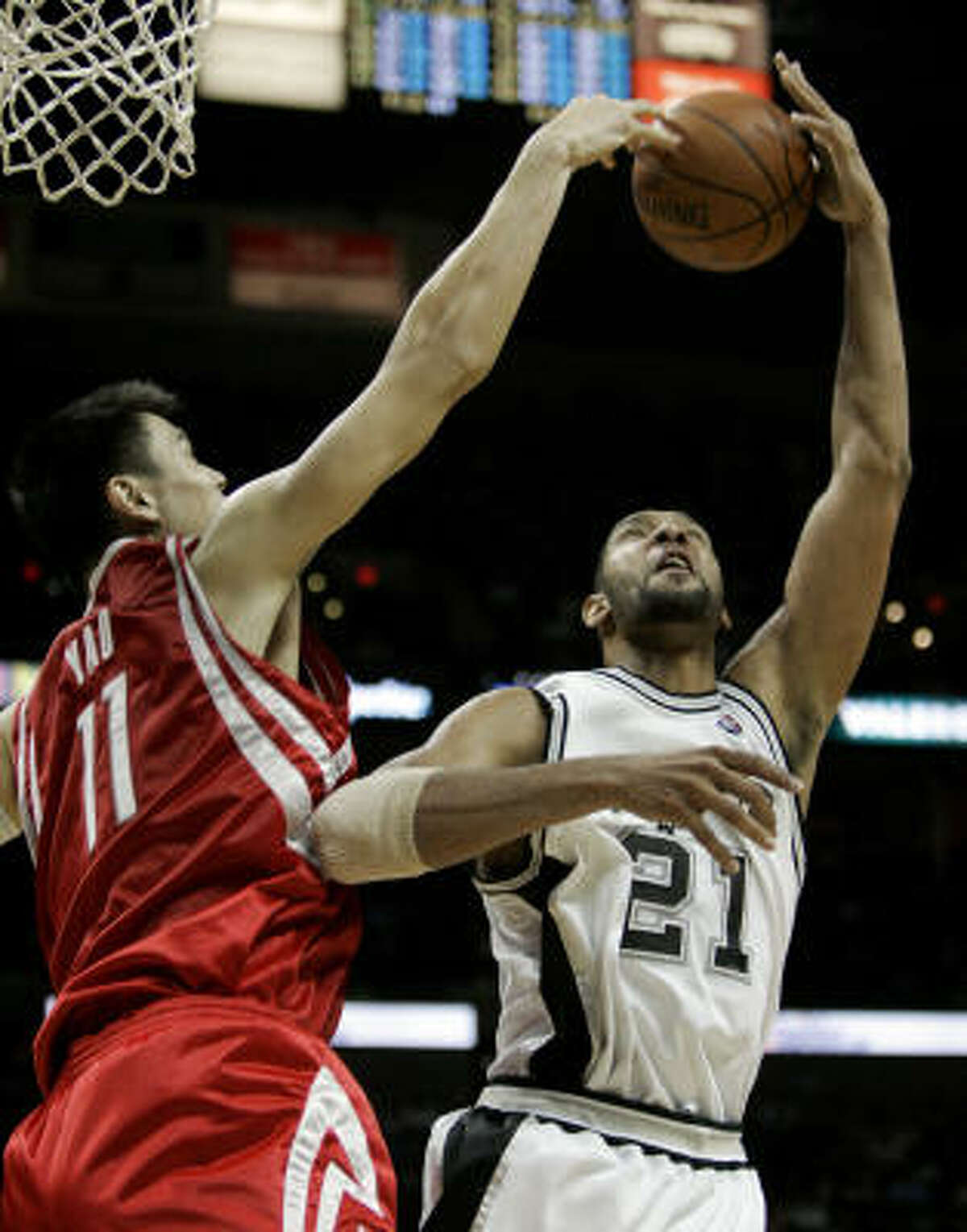 Houston's Yao Ming blocks San Antonio's Tim Duncan.