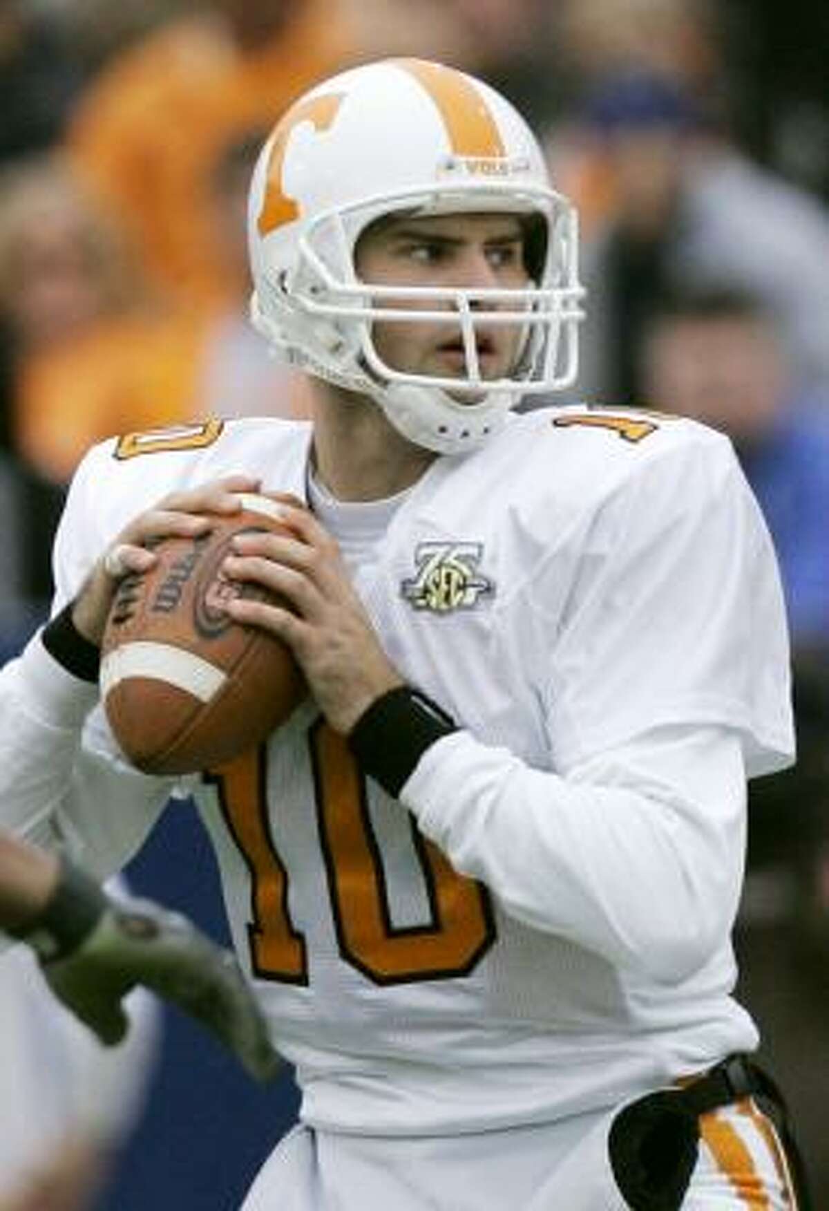 Tennessee quarterback Erik Ainge helped the Vols edge Kentucky 52-50 in four overtimes by passing for 397 yards and seven touchdowns.
