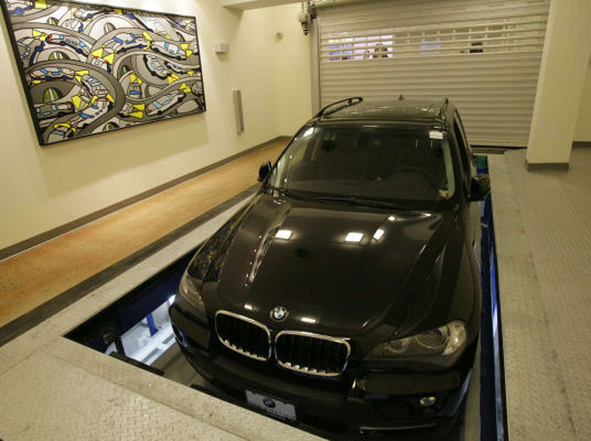 The vehicle is lowered through the floor into the automated parking garage in New York.