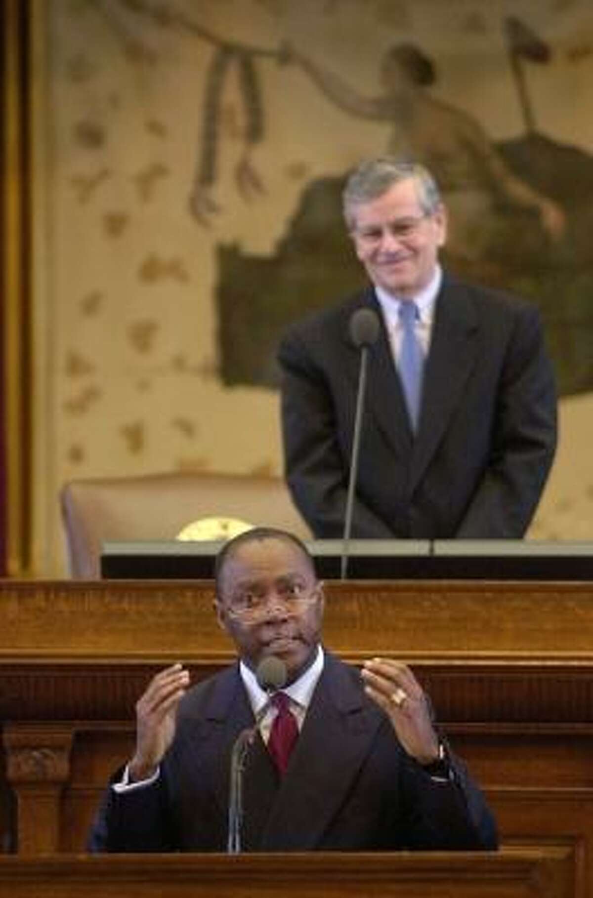 Rep. Sylvester Turner, D-Houston, shown addressing the state House in 2003, says he's still be loyal to Speaker Tom Craddick, background.