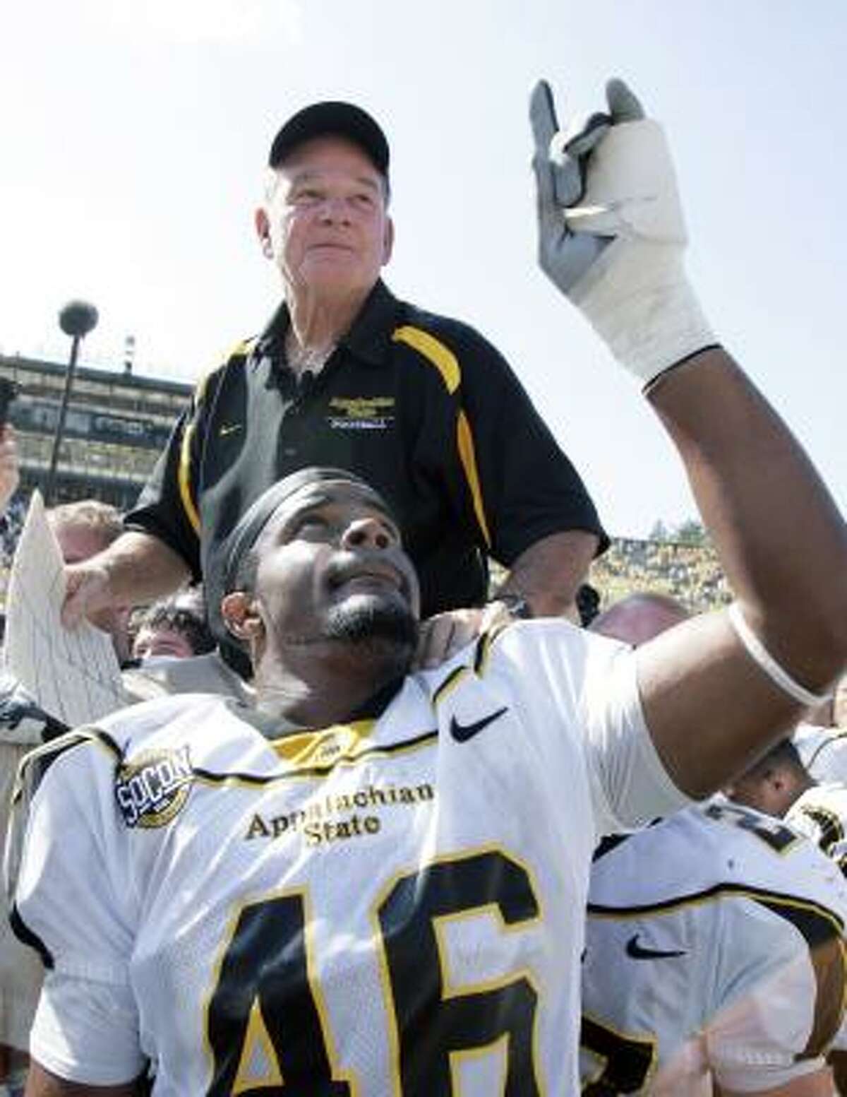 Tony Robertson and his teammates give Appalachian State coach Jerry Moore the ride of his life.
